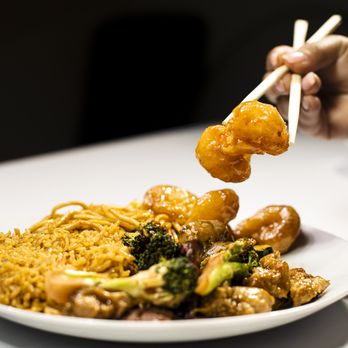 Happy Dragon - a plate of food with chopsticks - Chinese Near Me - Bakersfield, California