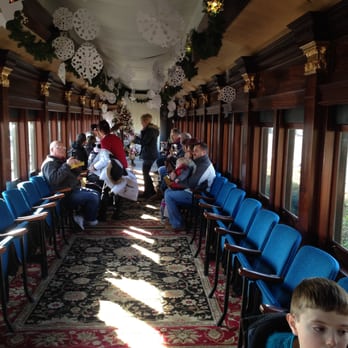 Colebrookdale Railroad - Long view of the restored parlor car, with Christmas tree and a harpist. - Historical Tours Near Me - Boyertown, Pennsylvania Colebrookdale Railroad - Long view of the restored parlor car, with Christmas tree and a harpist. - Historical Tours Near Me - Boyertown, Pennsylvania