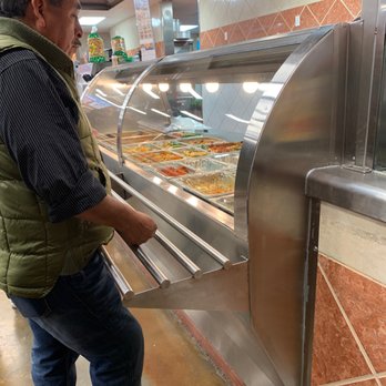 La Michoacana Meat Market - Line for delicious foods like tacos, arepas, tortas etc - Meat Shops Near Me - Katy, Texas