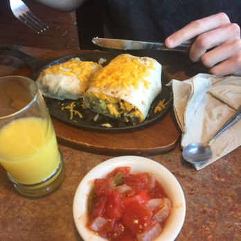 Huckleberry's - My husbands breakfast burrito! So filing he could only finish half. - Breakfast & Brunch Near Me - Fairfield, California