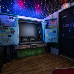The popular Shaggin' Wagon playroom at Oasis Aqualounge-get in the back of the van!