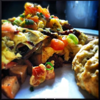 B Matthews Eatery - Bay Street Scramble with roasted potatoes and a biscuit at B. Matthew's. - New American Near Me - Savannah, Georgia