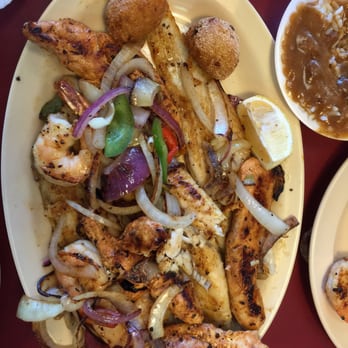 Sam's Southern Eatery - Combo w/grilled shrimp, fish, chicken & green peppers & onions - American Near Me - Little Rock, Arkansas Sam's Southern Eatery - Combo w/grilled shrimp, fish, chicken & green peppers & onions - American Near Me - Little Rock, Arkansas