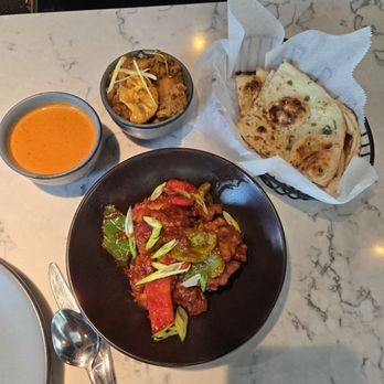 Kinaara - Chili chicken, garlic Naan, side of aloo Gobi, side of Tikka masala sauce - Indian Near Me - Omaha, Nebraska Kinaara - Chili chicken, garlic Naan, side of aloo Gobi, side of Tikka masala sauce - Indian Near Me - Omaha, Nebraska