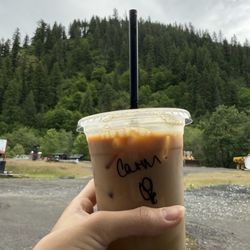 Caliber Coffee - Caramel iced coffee with a view of town