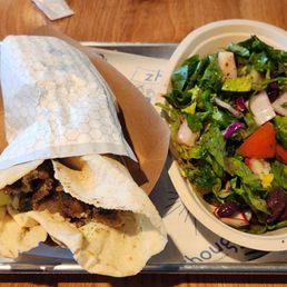 Gyro on a paper thin pita with a side salad. Tasty Gyro on a paper thin pita with a side salad. Tasty