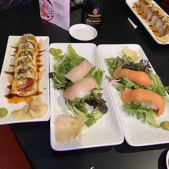 Rock N Roll Sushi - Uncensored roll, yellowtail nigiri, salmon nigiri, & my friend's roll up in the corner. - Sushi Bars Near Me - Duluth, Georgia