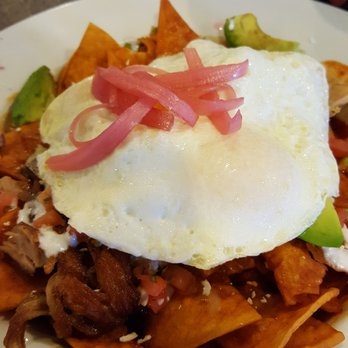 Toast - Carnitas Chilaquiles, my favorite dish... pork carnitas, crunchy salsa-soaked tortilla chips, creamy avocado, topped with an over-easy egg - Breakfast & Brunch Near Me - Littleton, Colorado Toast - Carnitas Chilaquiles, my favorite dish... pork carnitas, crunchy salsa-soaked tortilla chips, creamy avocado, topped with an over-easy egg - Breakfast & Brunch Near Me - Littleton, Colorado