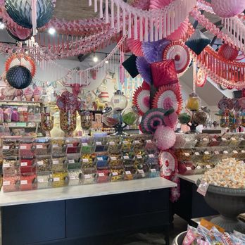 Pinkitzel Cupcakes and Candy - Pink streamers and jars of candy. - Candy Stores Near Me - McKinney, Texas