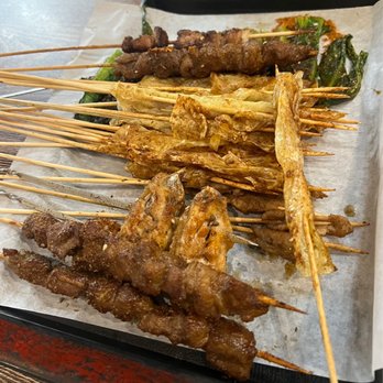 Chinese BBQ - (In no particular order) lamb, beef, tofu skin, beef (small), a choy, chicken wings, and pork belly - Chinese Near Me - Plano, Texas