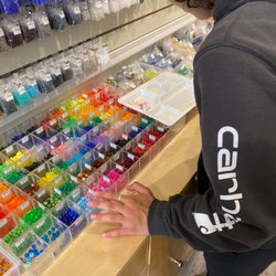 Selecting beads with a tray.