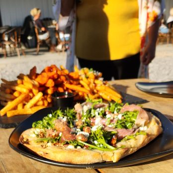 Brazen brewing - a pizza and fries on a table - Breweries Near Me - Lancaster, New York