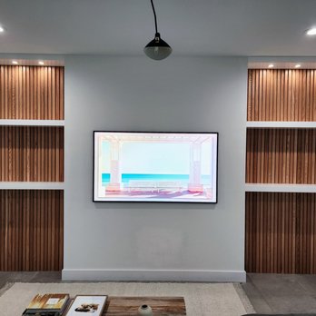 Pro Quality Carpentry - Custom made oak slat wall and floating shelves - Carpenters Near Me