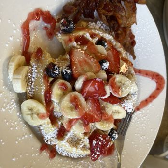 Savory's - Fruit explosion waffle with a side of bacon. (Missing one bite of waffle because I was impatient!) - Diners Near Me - Hamburg, New York Savory's - Fruit explosion waffle with a side of bacon. (Missing one bite of waffle because I was impatient!) - Diners Near Me - Hamburg, New York