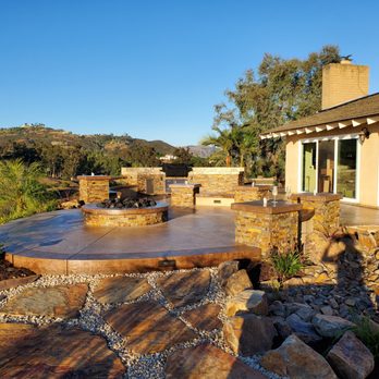 Rivers Landscape Construction - We installed a fire pit, stone columns, stamped concrete, flagstone, a dry river bed, and a new stamped concrete staircase to pool. - Masonry/Concrete Near Me - Escondido, California