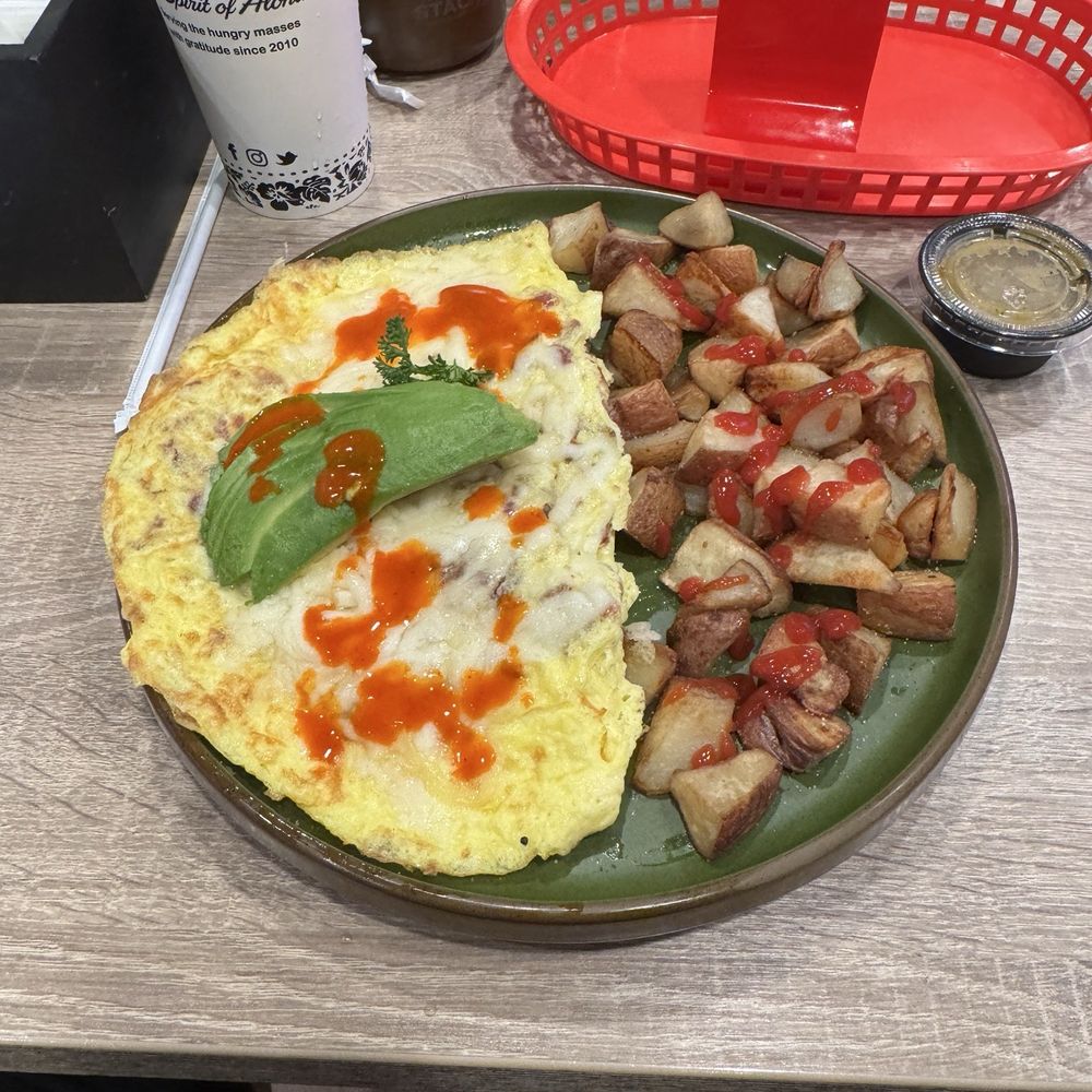 I had this California omelette. Wife had a stack of pineapple coconut pancakes!! I had this California omelette. Wife had a stack of pineapple coconut pancakes!!