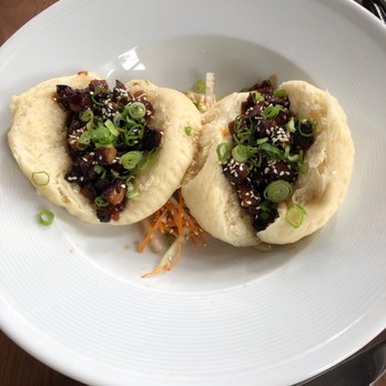 REDD - Two Pork Belly Steamed Buns that we each had as we split the order. - New American Near Me - Rochester, New York