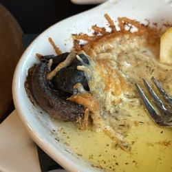 The Bank 1884 Food & Spirits - Escargot in mushroom caps with baked Parmesan cheese