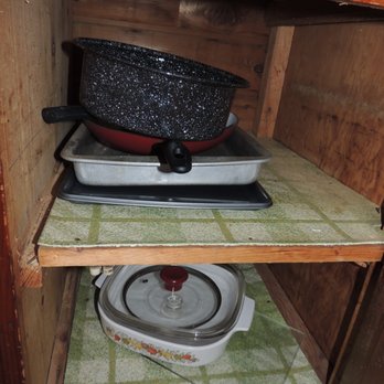 Pine Haven Resort - The cupboards are stocked with everything you'd need to cook! - Resorts Near Me - Tawas City, Michigan