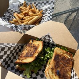 Chicken melt sandwich .  An order of fries.