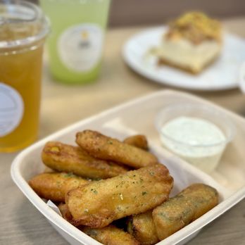 Hungry Zus - a plate of fried zucchini sticks and a glass of lemonade - Mediterranean Near Me - Vancouver, British Columbia
