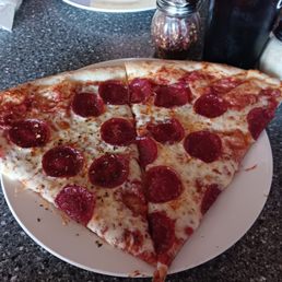 2 slices of thin crust pepperoni pizza, huge.