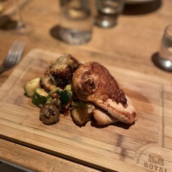 Claudette - a plate of food on a wooden cutting board - French Near Me - New York, New York