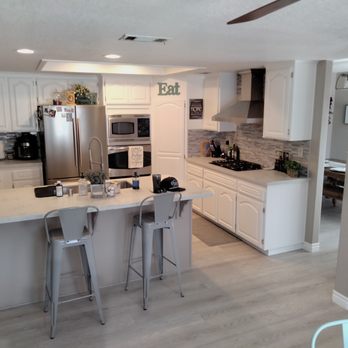 Carpeteria Flooring Centers - a kitchen with white cabinets and stainless steel appliances - Carpeting Near Me - Victorville, California Carpeteria Flooring Centers - a kitchen with white cabinets and stainless steel appliances - Carpeting Near Me - Victorville, California