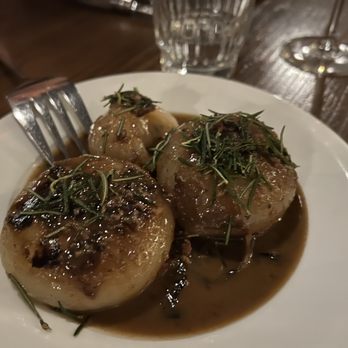 Il Nido - Cipollini, balsamic braised onions, prosciutto butter, fried rosemary, parmigiana brodo - Italian Near Me - Seattle, Washington Il Nido - Cipollini, balsamic braised onions, prosciutto butter, fried rosemary, parmigiana brodo - Italian Near Me - Seattle, Washington
