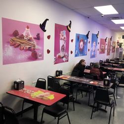 El Cafe By La Abuela - The tables along the left wall