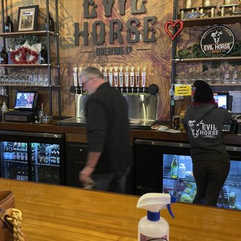 Evil Horse Brewing Company - two men in a bar - Breweries Near Me - Crete, Illinois Evil Horse Brewing Company - two men in a bar - Breweries Near Me - Crete, Illinois