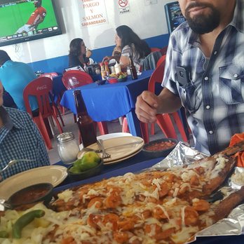 Chewins - Hubby with the smallest pescado sarandiado they had. - Seafood Near Me - Tijuana, BCN Chewins - Hubby with the smallest pescado sarandiado they had. - Seafood Near Me - Tijuana, BCN