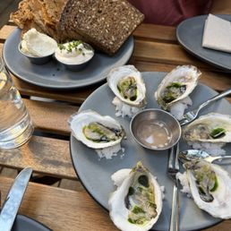 Oysters and bread service Oysters and bread service