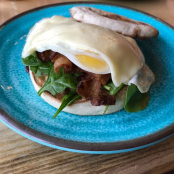 Caffe Social - Caffe Social's bacon-egg-and-cheese sandwich: toasted English muffin, perfect run to the egg and fresh spinach and crisp bacon - American Near Me - Norwalk, Connecticut