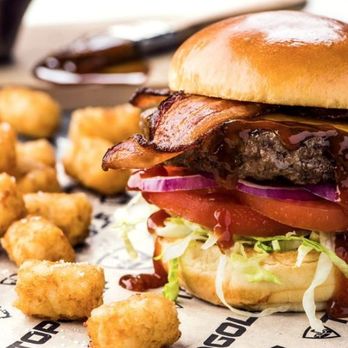 Topgolf - a burger and tater tots on a plate - Golf Near Me - King of Prussia, Pennsylvania Topgolf - a burger and tater tots on a plate - Golf Near Me - King of Prussia, Pennsylvania