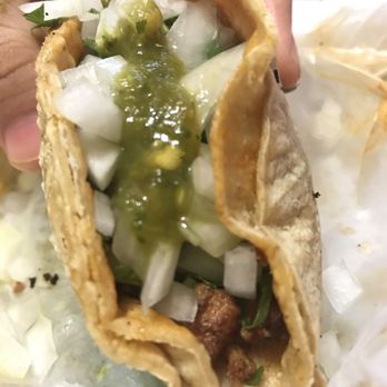 Paco's Tacos - Al pastor taco (1st person view with cilantro, onions, and salsa verde) - Mexican Near Me - Chicago, Illinois