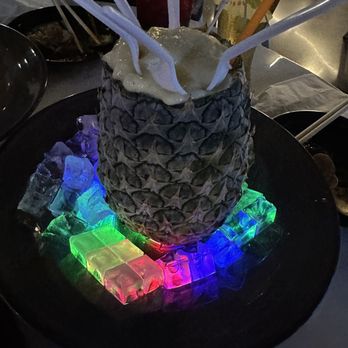 Sum Fusion Kitchen & Bar - a pineapple decorated with ice cubes - Asian Fusion Near Me - Carrollton, Texas Sum Fusion Kitchen & Bar - a pineapple decorated with ice cubes - Asian Fusion Near Me - Carrollton, Texas