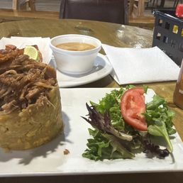 Mofongo con pernil (roasted pork), chicharrón, pork belly), y fresca tamarindo (Tamarind flavored soda). Mofongo con pernil (roasted pork), chicharrón, pork belly), y fresca tamarindo (Tamarind flavored soda).