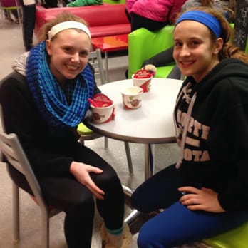 CherryBerry - two girls sitting at a table in a cafeteria - Desserts Near Me - Vadnais Heights, Minnesota