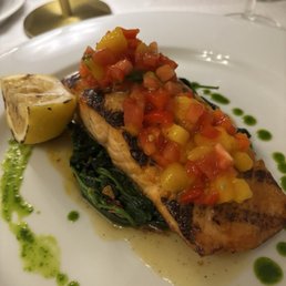 grilled salmon special with mango salsa on a bed of sautéed spinach. delicious! grilled salmon special with mango salsa on a bed of sautéed spinach. delicious!