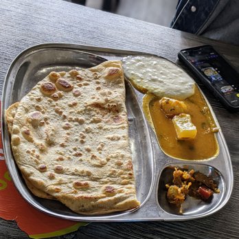 Ghareeb Nawaz - Aloo paratha: bread with yogurt, spicy potato curry and pickled chutney - Indian Near Me - Chicago, Illinois Ghareeb Nawaz - Aloo paratha: bread with yogurt, spicy potato curry and pickled chutney - Indian Near Me - Chicago, Illinois
