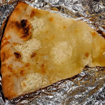 Don Filippo Restaurant - a piece of pizza wrapped in foil - Pizza Near Me - New York, New York Don Filippo Restaurant - a piece of pizza wrapped in foil - Pizza Near Me - New York, New York