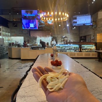 Due Amici Pizza & Pasta Bar - The amazing huge table in the front and my handful of fresh cheese!! - Pizza Near Me - Tampa, Florida