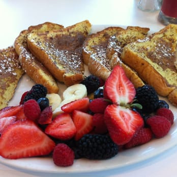 Eggs Frutti - French toast with berries and bananas, served with custard on side (not shown) - Breakfast & Brunch Near Me - Montreal, Quebec Eggs Frutti - French toast with berries and bananas, served with custard on side (not shown) - Breakfast & Brunch Near Me - Montreal, Quebec