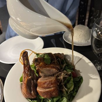 Noi Thai Cuisine - Tamarind Duck, so crispy, on a bed of spinach with tamarind sauce - Thai Near Me - Bend, Oregon