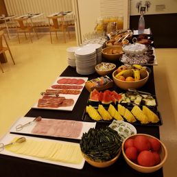 Great variety of fruit, cheese and ham.
