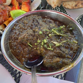 Masala Express - a bowl of masala and a plate of pita bread - Indian Near Me - Santa Rosa, California Masala Express - a bowl of masala and a plate of pita bread - Indian Near Me - Santa Rosa, California