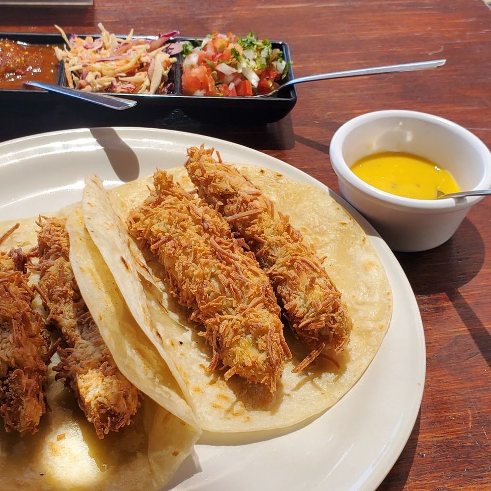 Omega - Two huge Coconut Crusted Fish Tacos. Before adding the toppings. - Mexican Near Me - Cabo San Lucas, BCS