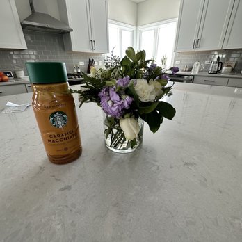Designs By Guzzardos - The replacement flowers that is not comparable in value or size. Smaller than Starbucks bottle. Also with broken rose stems. - Florists Near Me - Melrose Park, Illinois