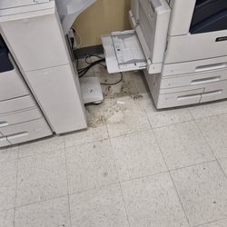 Office Depot - Trash and dirt below the Office Depot copy machines..all of them!